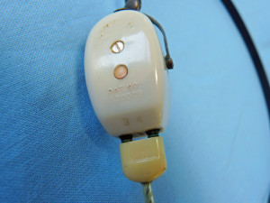 Acousticon Model A-335 Transistor Body Hearing Aid Bone Conduction Transducer with Newer Style Cord Plugged In